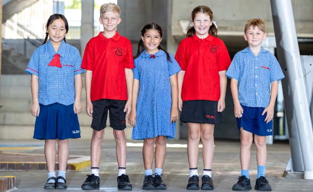 Five students in blue and red school uniforms.